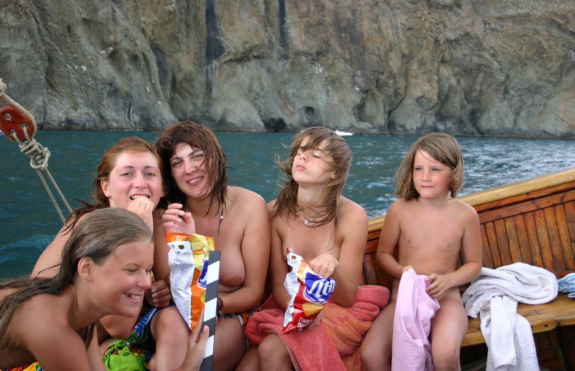 Nudist Pictures Group Snacking on Boat - 1