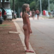 Naturist Child on Sidewalk