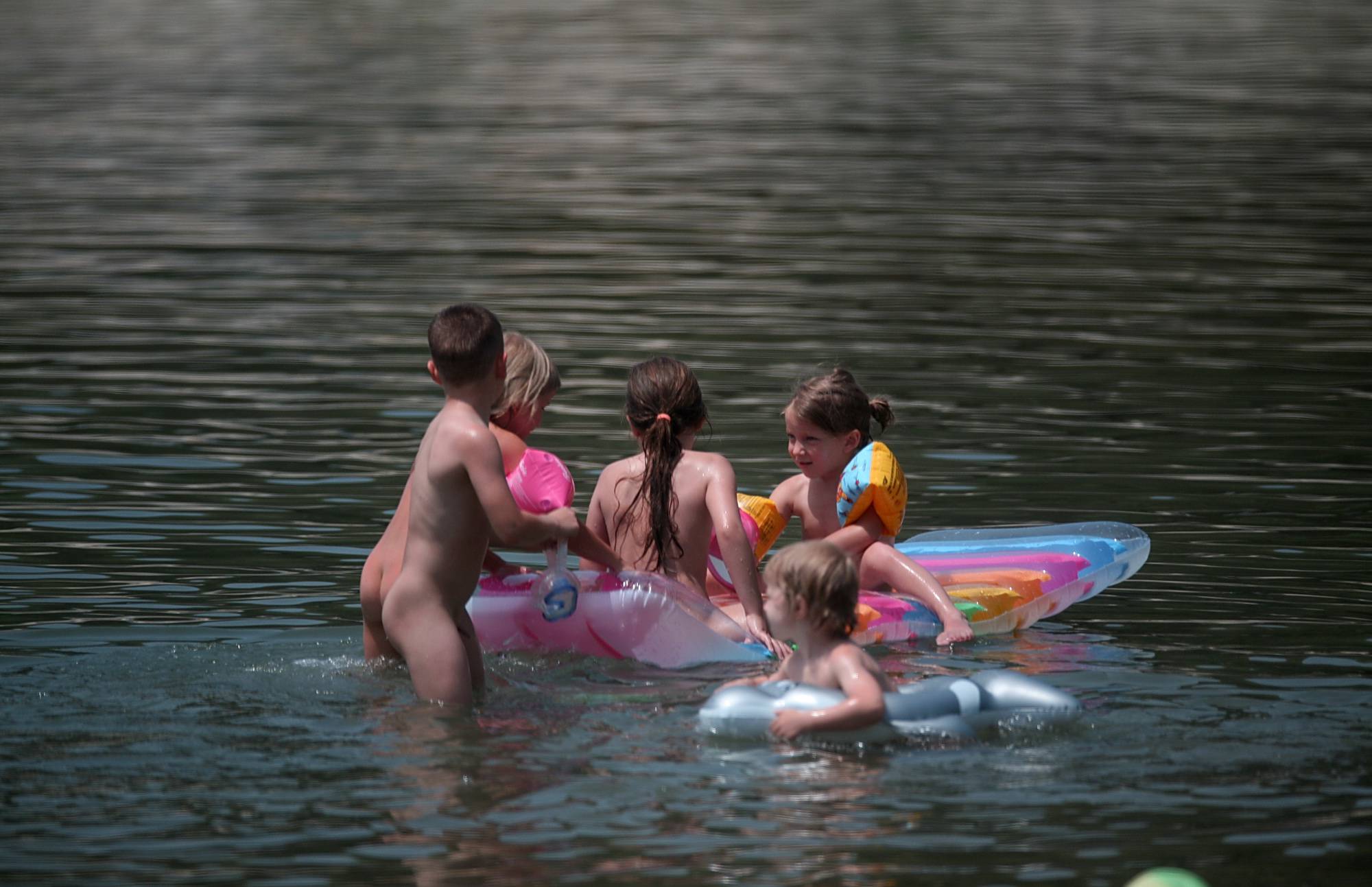 Nudist Pictures Relax Aboard A Floaty Raft - 2